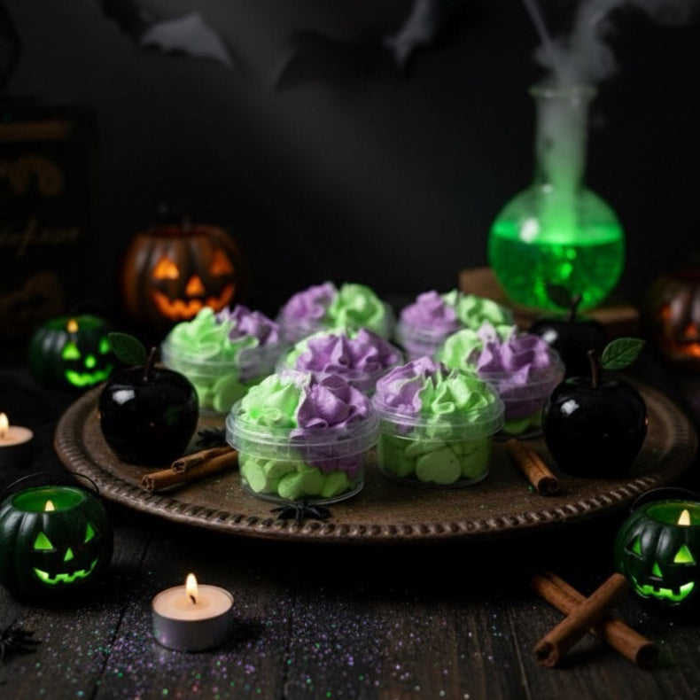 Halloween-themed setup with green and purple decorations, candles, and a dark background.